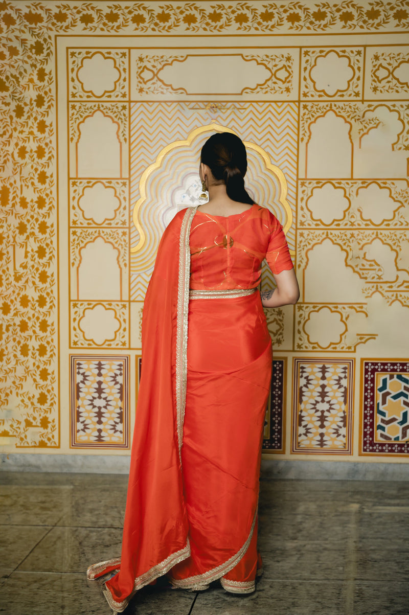 orange traditional saree with matching blouse
