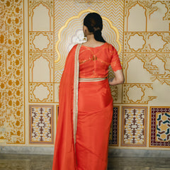orange traditional saree with matching blouse
