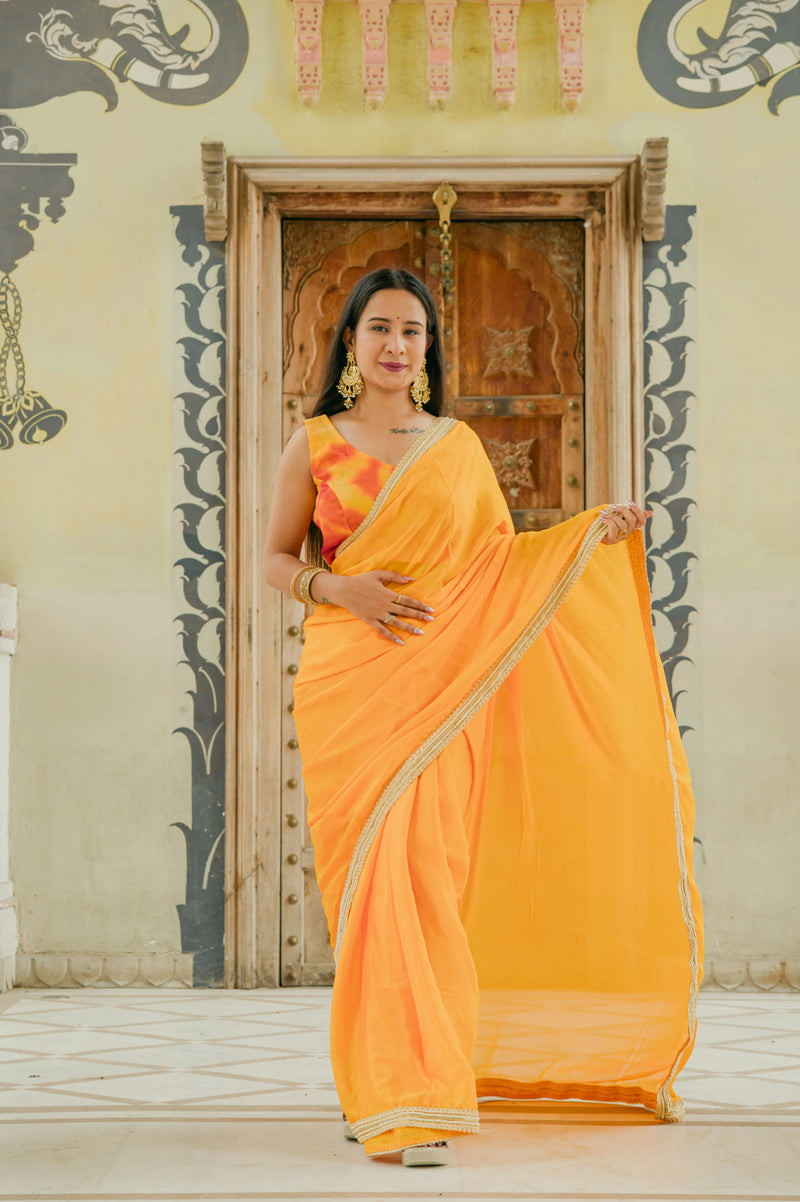 Festive yellow saree with tie dye blouse
