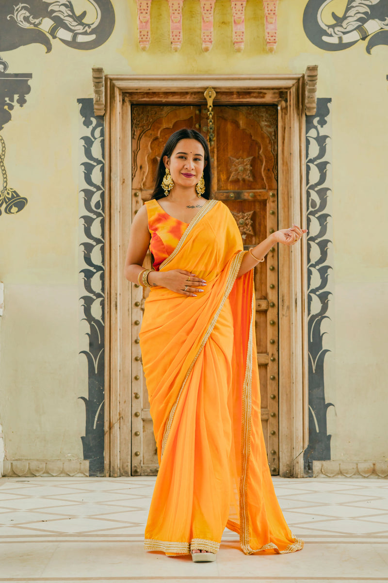 Women wearing yellow chinnon saree