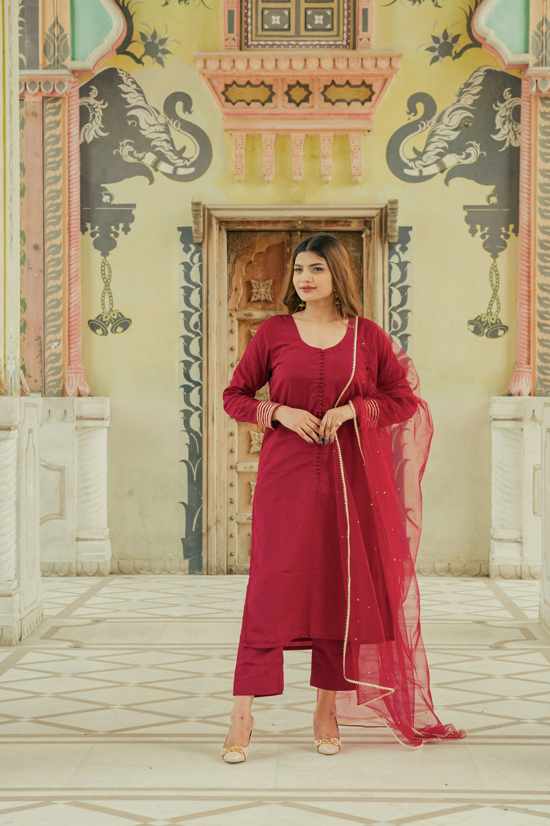 Elegant maroon party wear suit for women
