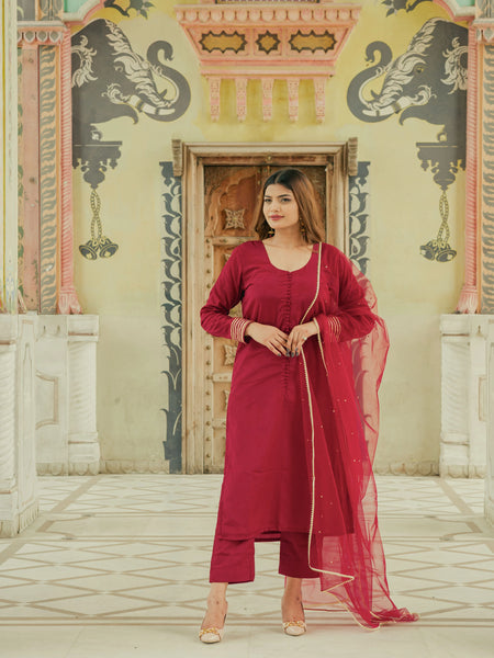 Elegant maroon party wear suit for women
