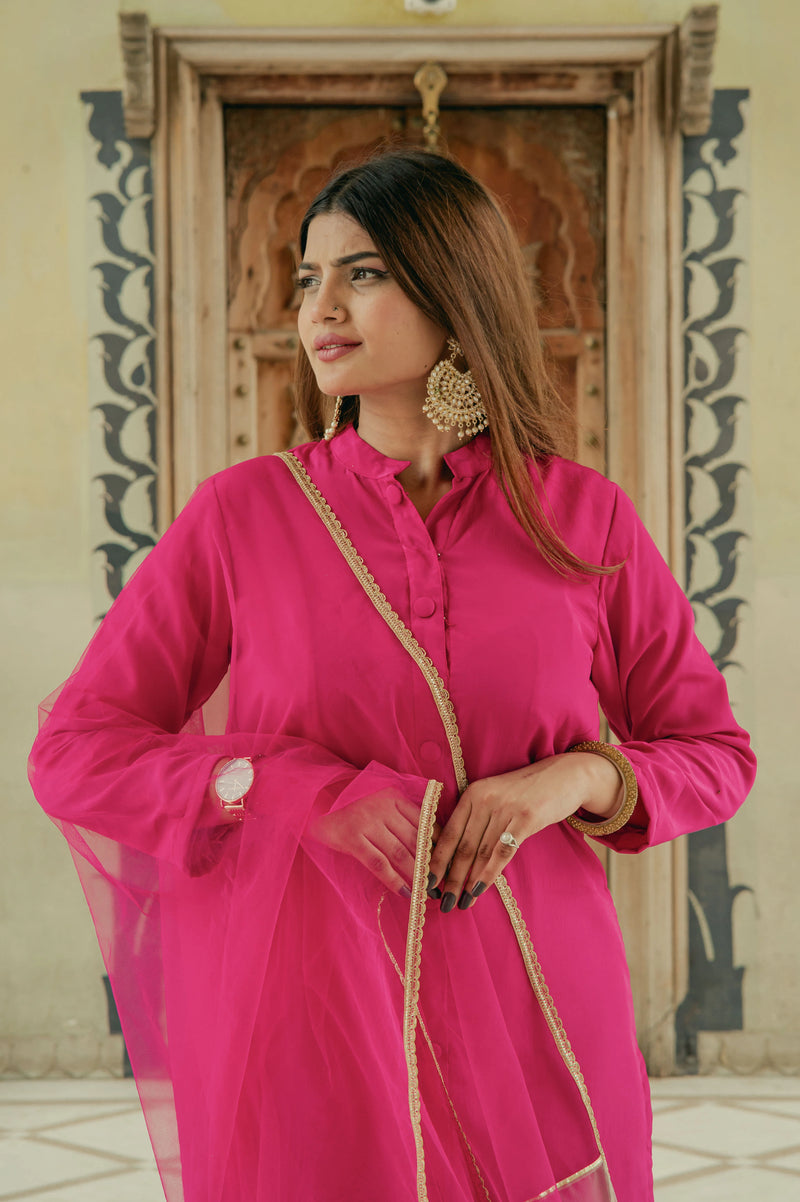 Women wearing pink party wear suit set
