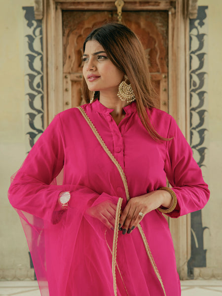 Women wearing pink party wear suit set
