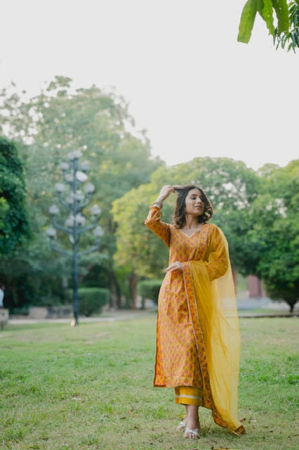 Yellow cotton suit set with net dupatta
