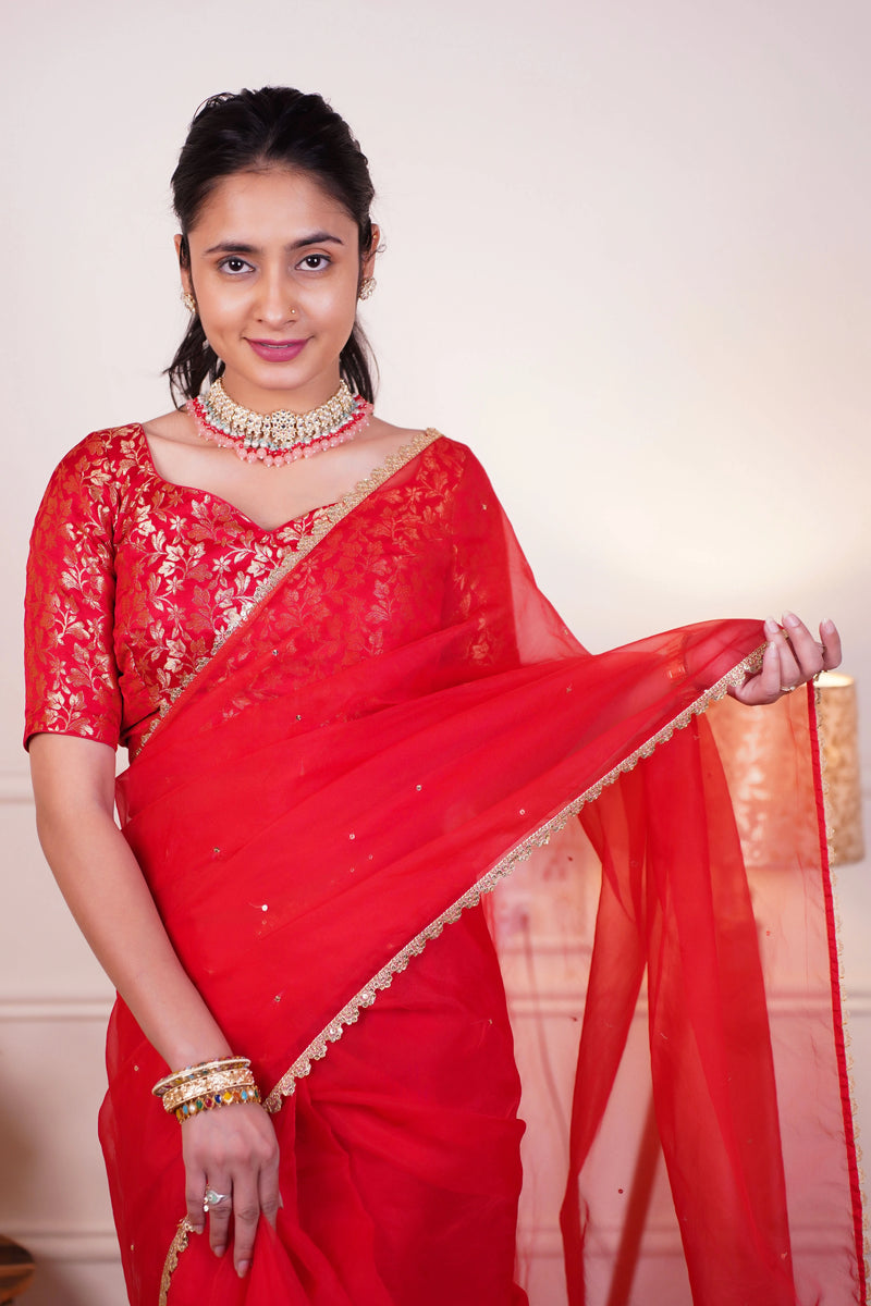Festive red saree with sequin lace border
