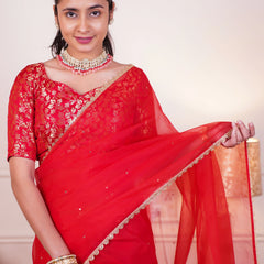 Festive red saree with sequin lace border

