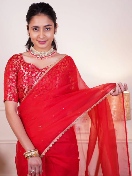 Festive red saree with sequin lace border
